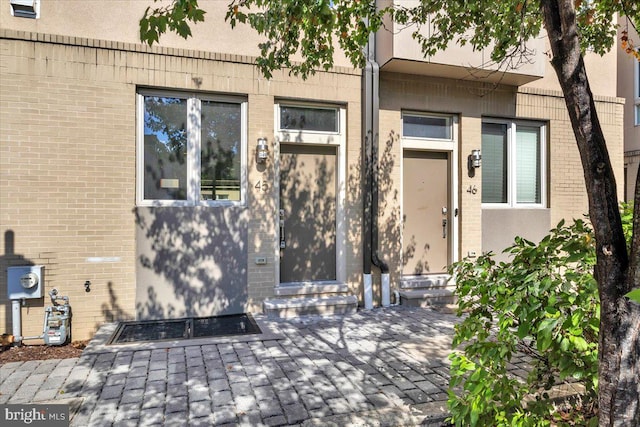 entrance to property with a patio