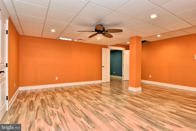 unfurnished room featuring light wood finished floors, baseboards, ceiling fan, recessed lighting, and a drop ceiling