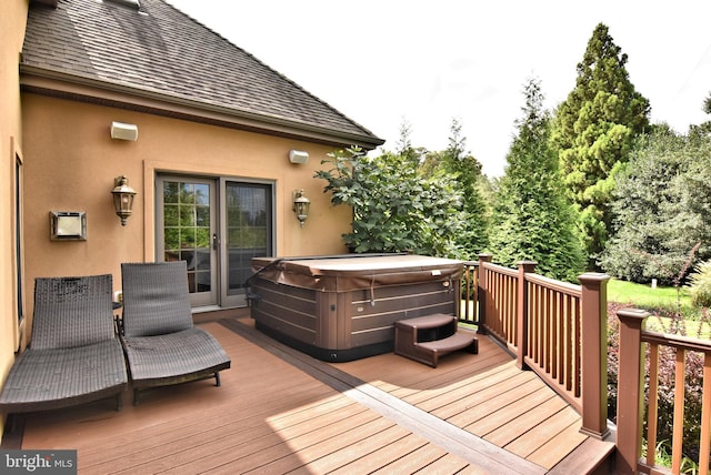 wooden terrace with a hot tub