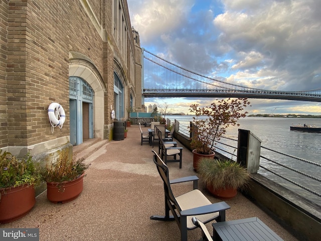 balcony featuring a patio and a water view