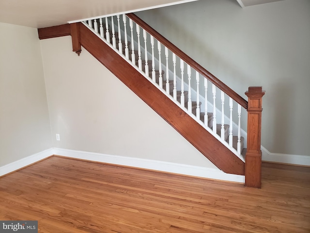 stairway featuring hardwood / wood-style floors