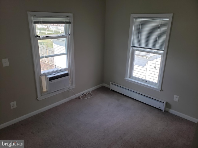 carpeted spare room featuring cooling unit and baseboard heating