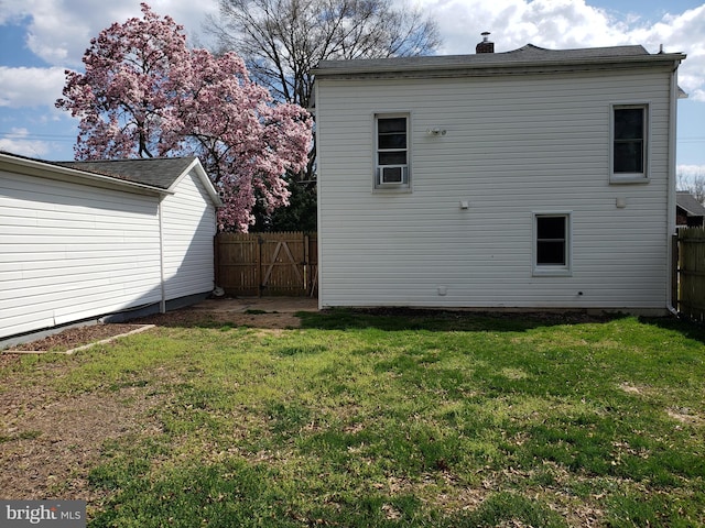 rear view of house with a lawn