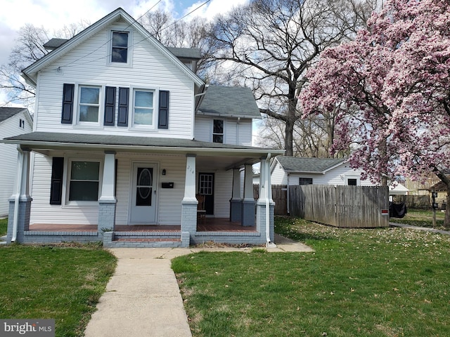 view of front of property featuring a porch and a front lawn