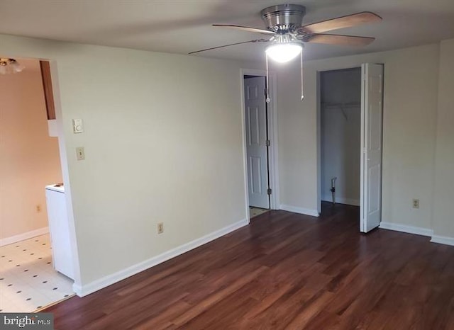 interior space featuring ceiling fan and dark wood-type flooring