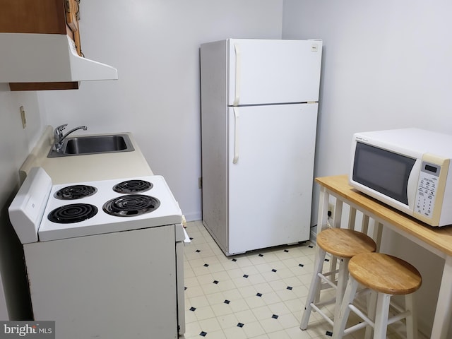 kitchen featuring sink and white appliances