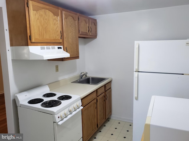 kitchen with white appliances and sink