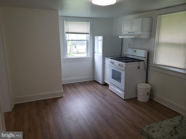 kitchen with light stone counters, hardwood / wood-style flooring, white appliances, and white cabinetry