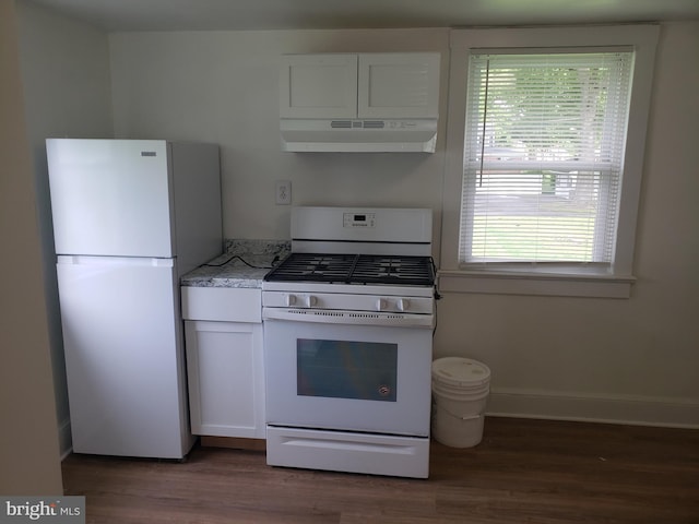 kitchen with light stone counters, white cabinets, dark hardwood / wood-style flooring, and white appliances