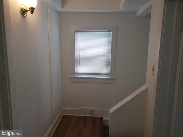 hallway featuring dark hardwood / wood-style flooring