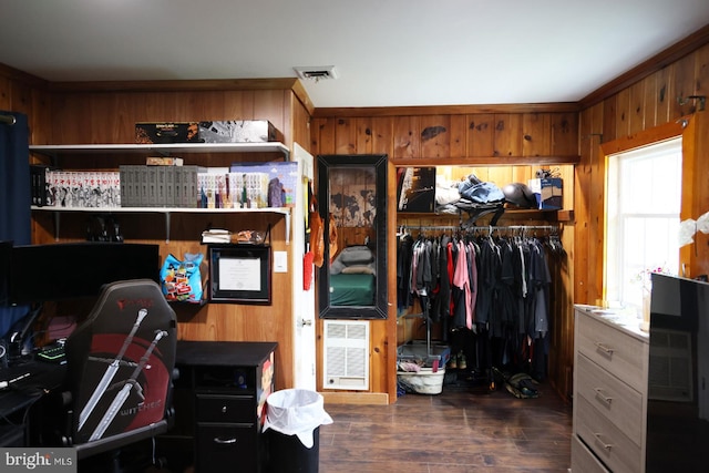 interior space with heating unit and dark wood-type flooring