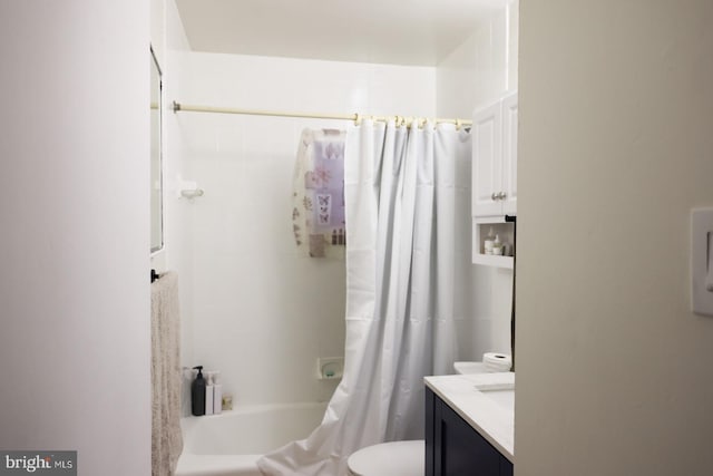 full bathroom featuring toilet, vanity, and shower / tub combo with curtain