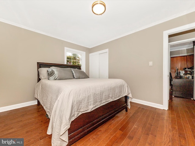 bedroom featuring wood-type flooring and ornamental molding