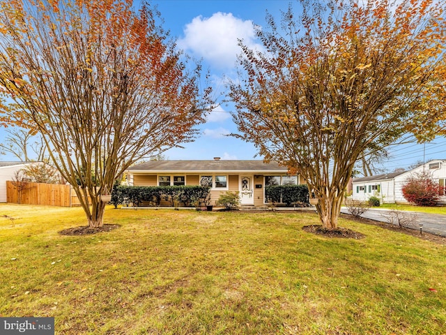 ranch-style house with a front yard