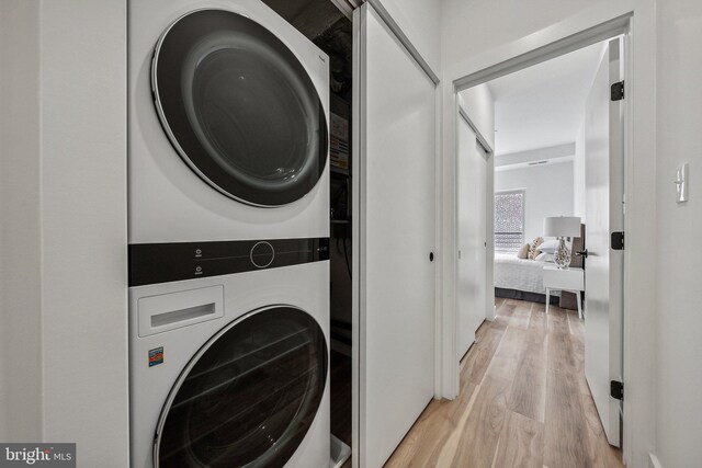 2015 13th St NW Unit 3, Washington, DC 20009 - washroom with light wood finished floors, stacked washer and clothes dryer, and laundry area