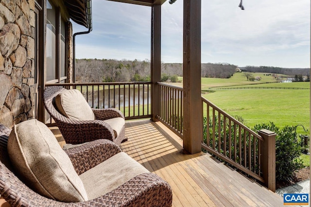 wooden deck featuring a yard