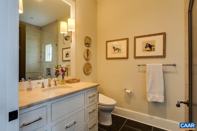 bathroom featuring vanity, tile patterned flooring, toilet, and tiled shower