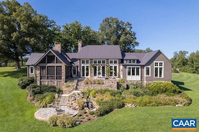 rear view of house with a lawn