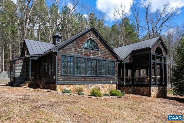 view of front of house featuring a sunroom