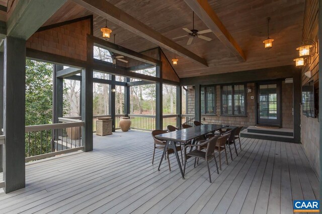 sunroom / solarium with vaulted ceiling with beams, ceiling fan, and wooden ceiling