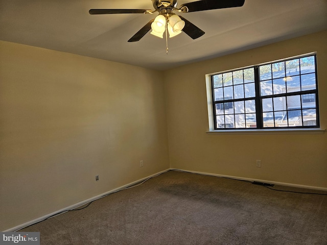 empty room featuring carpet floors and ceiling fan