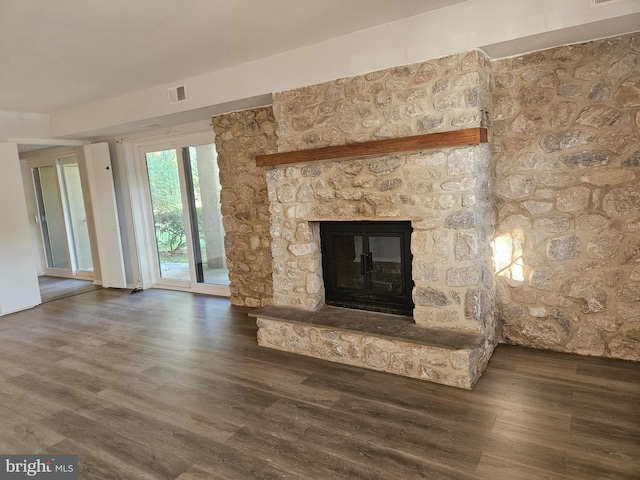 room details with hardwood / wood-style floors and a fireplace