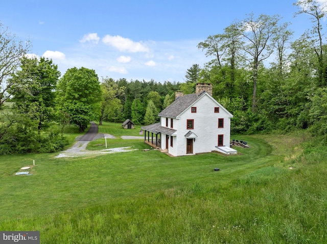 view of home's exterior with a lawn