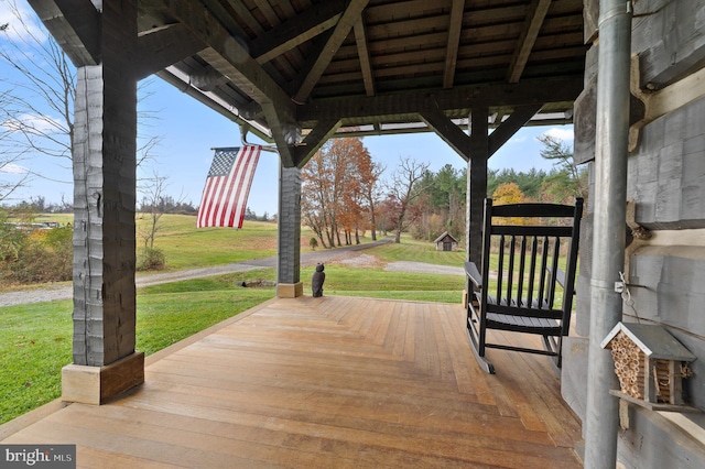 wooden deck featuring a gazebo and a yard