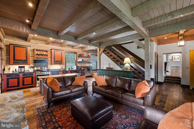 living room featuring wood-type flooring and beamed ceiling