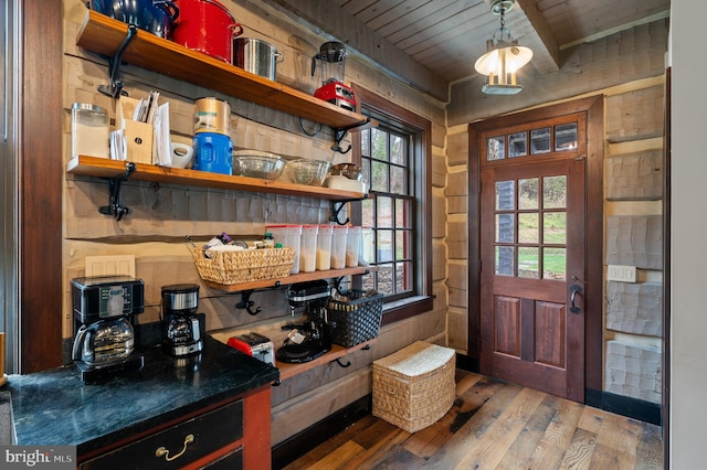 entrance foyer with hardwood / wood-style floors and wooden ceiling