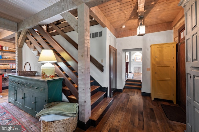 foyer featuring wooden ceiling, beamed ceiling, and dark hardwood / wood-style floors