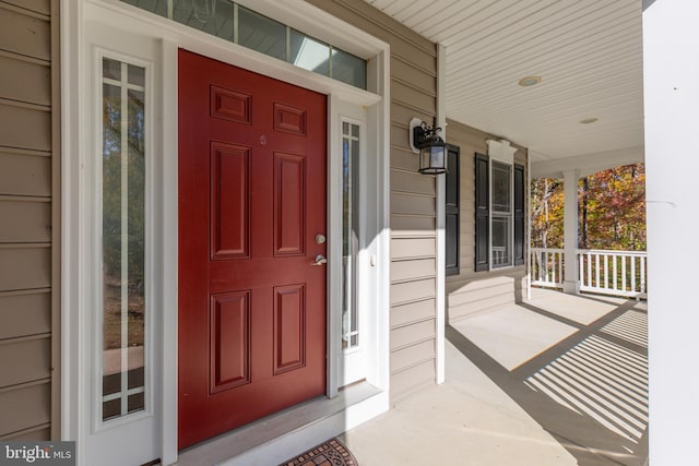 doorway to property featuring covered porch