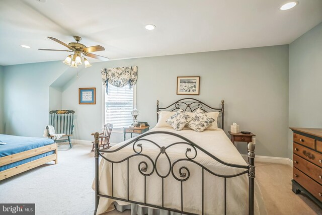 bedroom with ceiling fan and light colored carpet