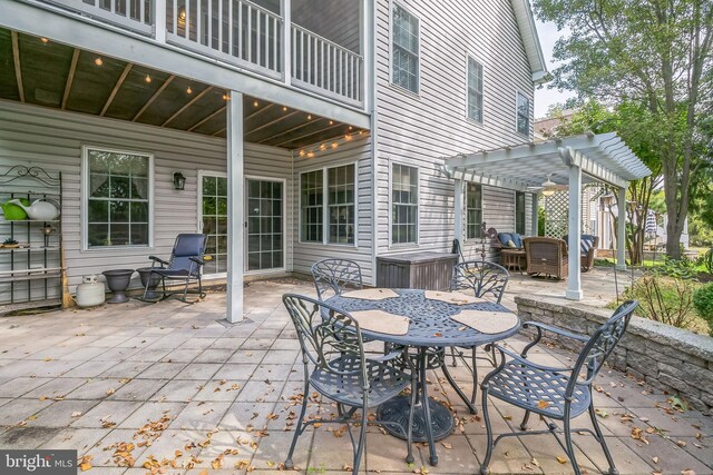 view of patio with a balcony and a pergola