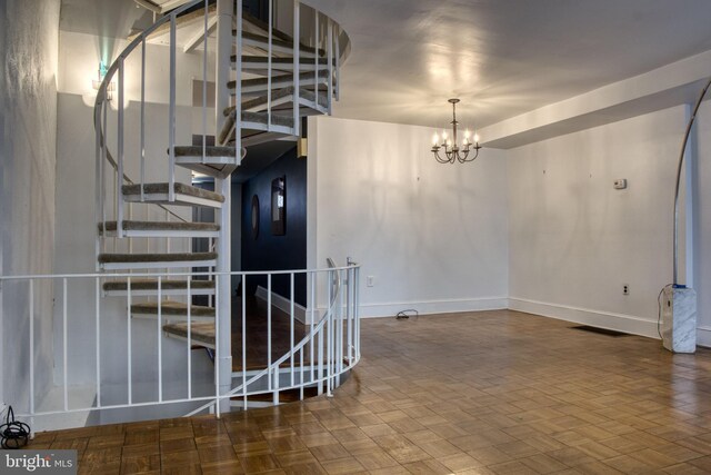 interior space featuring a chandelier and parquet floors