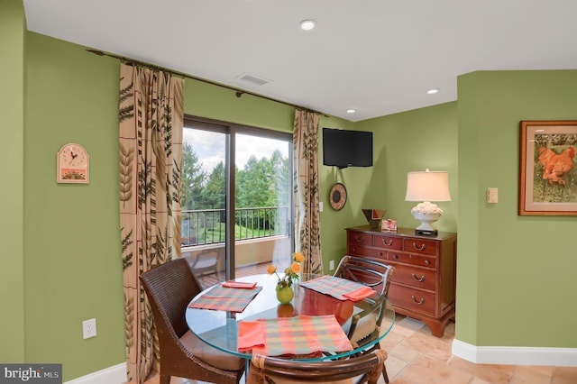 dining space with baseboards, visible vents, recessed lighting, and stone finish flooring