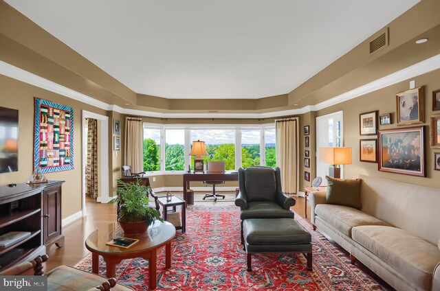 living room with ornamental molding