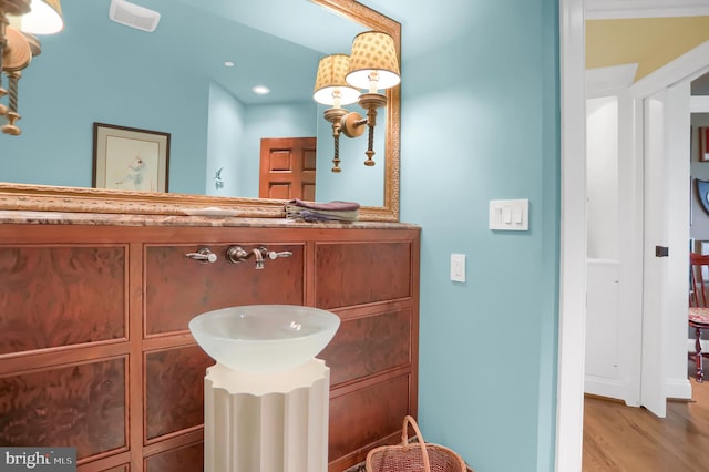 bathroom featuring vanity and hardwood / wood-style floors