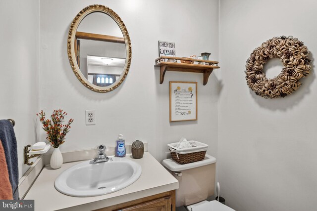 bathroom with vanity and toilet