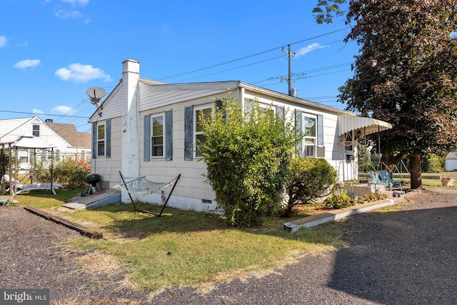 view of home's exterior featuring a yard