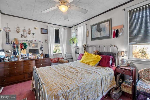 bedroom with ceiling fan, carpet floors, and crown molding