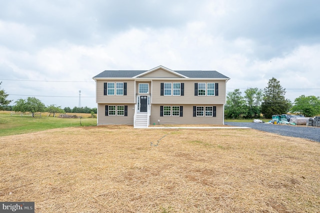 bi-level home featuring a front yard