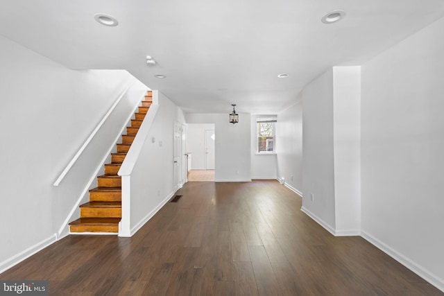 foyer entrance with dark wood-type flooring