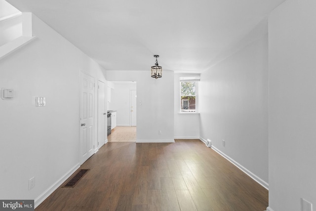 unfurnished living room with hardwood / wood-style flooring