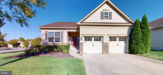 view of front facade with a garage and a front lawn