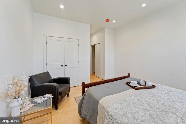 bedroom featuring a closet and light hardwood / wood-style floors