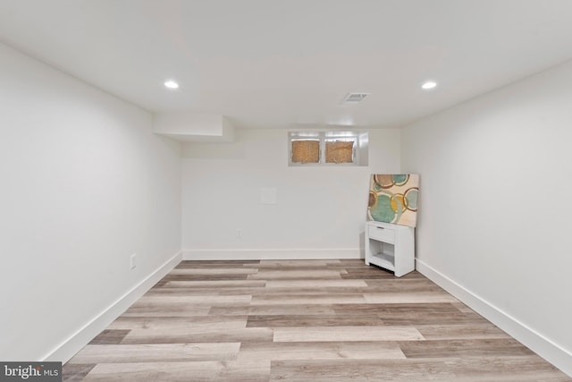 basement featuring light hardwood / wood-style flooring