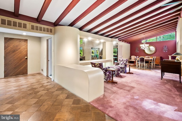 living room with vaulted ceiling with beams and a chandelier