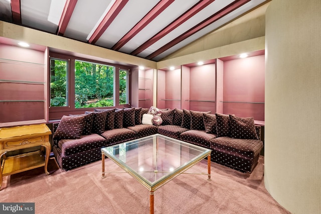 carpeted living room with vaulted ceiling with beams