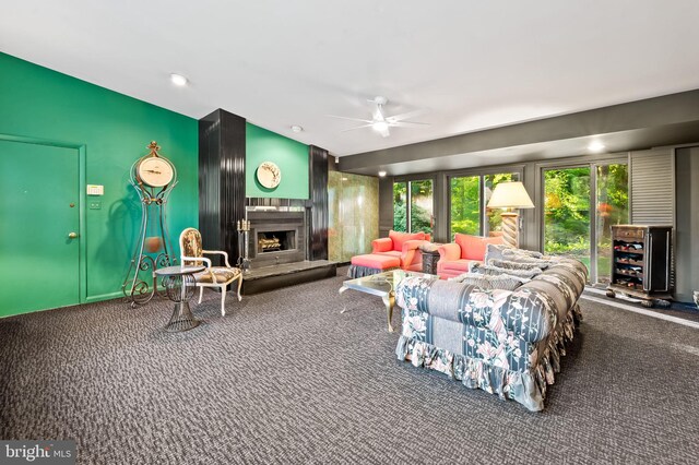 living room featuring carpet and ceiling fan